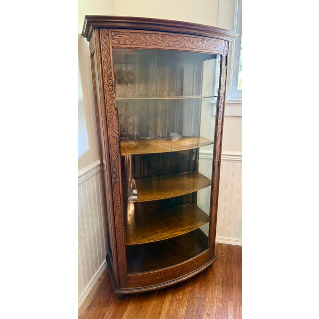 This China cabinet is designed for the elegant displays of China or collectibles with internal wooden shelving. It is a...