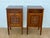 Elegant pair of French bedside cabinets crafted in wood and beautifully decorated with delicate marquetry and contrasting...