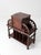 An exceptional early 20th century Jacobean Revival humidor stand featuring a copper-lined tobacco cabinet, beautifully...