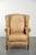 This beautiful light cowhide wing armchair has a timeless English look and good seating comfort. It features a fixed seat...
