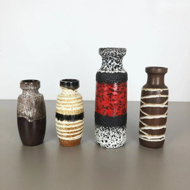 Set of four fat lava art vases producer: Scheurich, germany decade: 1970s model: 210-18 200-22 200-28 these original...