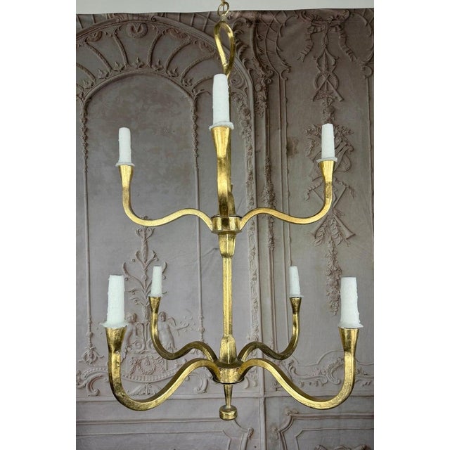 The Benedict chandelier by Miamar Home is a refined two-tier, eight-light fixture, handcrafted and finished in radiant,...