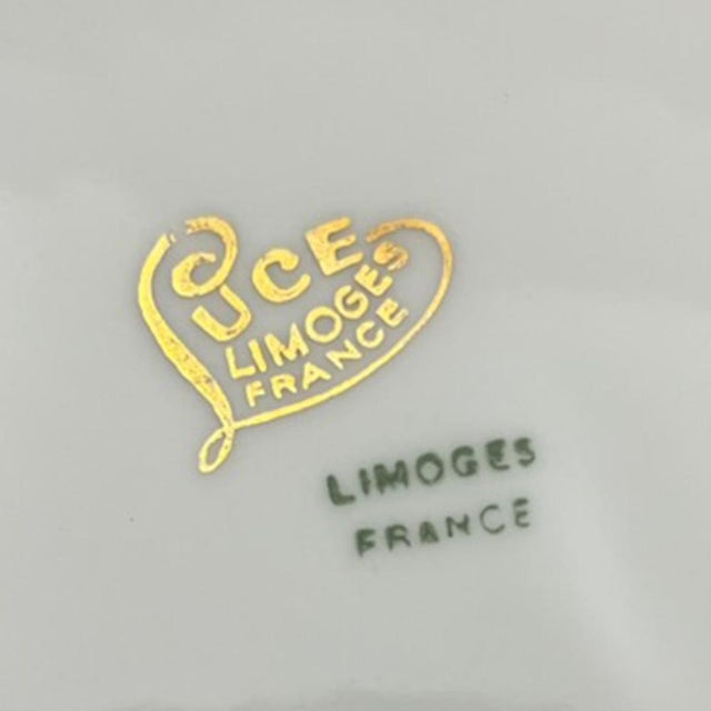 Luce hand-painted porcelain dessert service comprising twelve dessert plates, a pie dish, and two ramekins. Made in France...