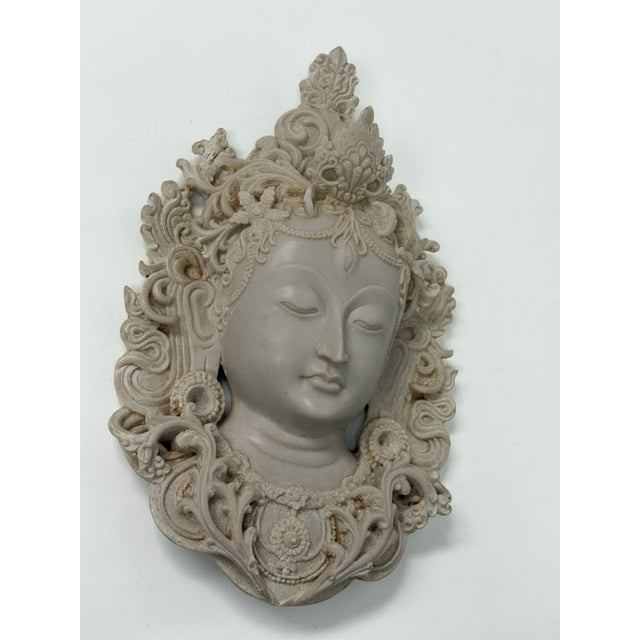 Design Plus Gallery presents a White Tibetan Tara Mask. A Tara mask is a decorative, spiritual art piece representing the...