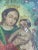 This painted icon showcases the Virgin and Child in a celestial setting, following the traditional Spanish colonial style....