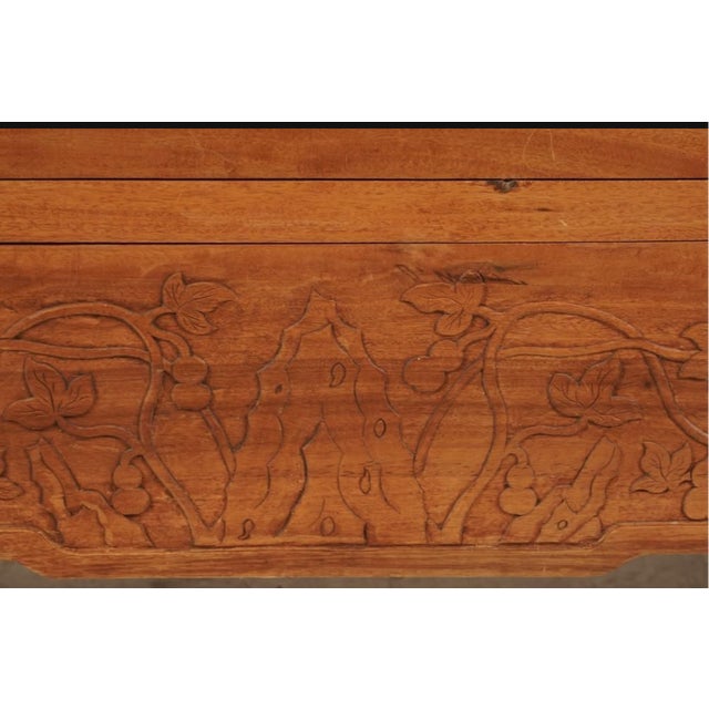 A beautifully aged vintage Chinese carved camphorwood cabinet with interior shelves and drawers. Versatile cabinet will...