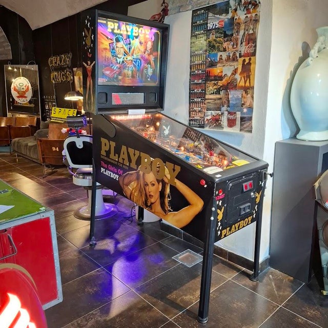 Designed by George Gomez The Stern PLAYBOY pinball machine features a book mechanism that opens and closes, along with...