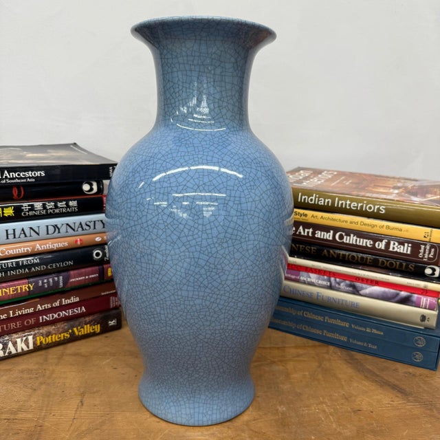 "About This Piece About This Piece This striking vase captures attention with its rich blue glaze, layered with a...