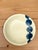 This vintage studio pottery plate is a sophisticated example of mid-century organic minimalism. Hand-thrown with...