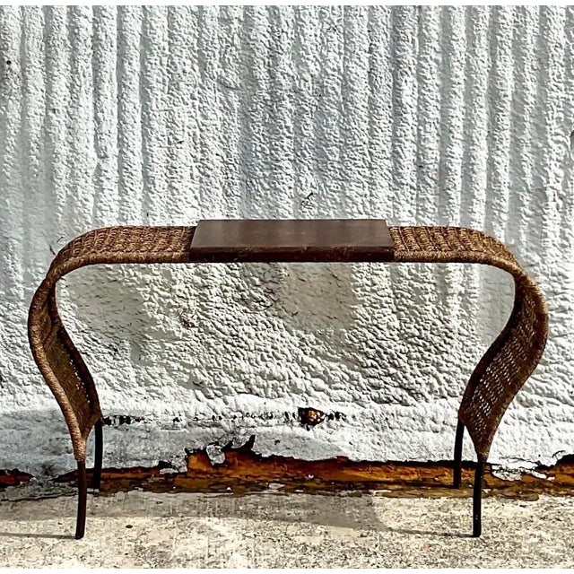 Elevate your space with this sculptural vintage coastal console table, a true statement piece blending organic texture...