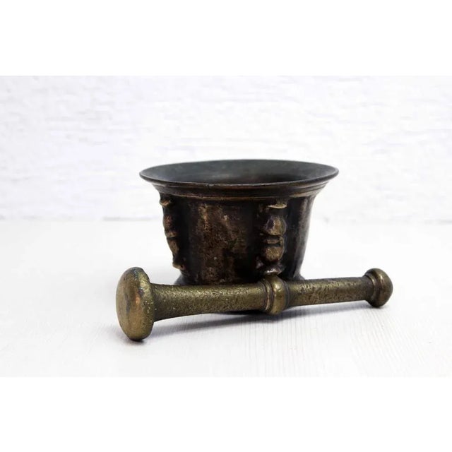Bronze mortar with its XVIIth century pestle Exhibit a history piece in your interior with this superb 17th century...