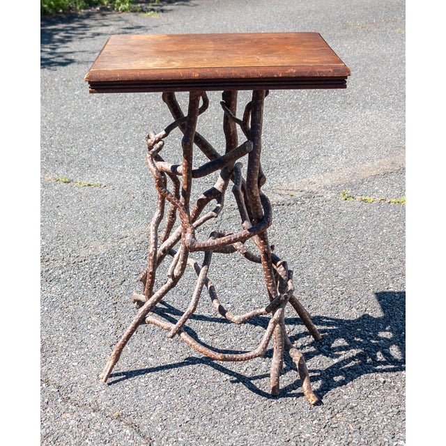 We are selling this great folk art Adirondack style table. This table has rustic look with almost root form base made from...