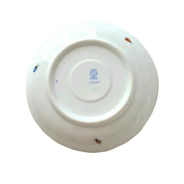 Herend RO 6.25" saucer that features hand-painted birds on a branch with scattered insects and butterflies, and scalloped...