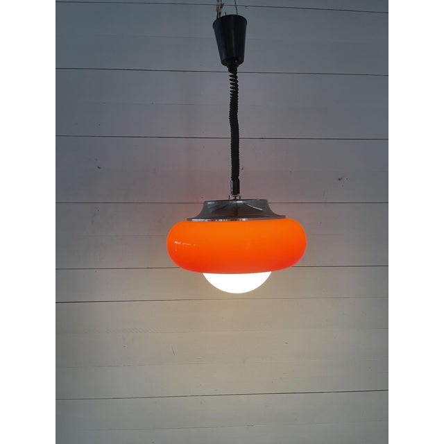 Vintage Harvey Guzzini Orange Space Age Pendant Lamp UFO Chrome Italian Design 1970s This piece has an attribution mark, I...