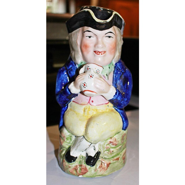 Wonderful 19c Stafforshire Toby mug in traditional soft paste ceramic, an 18c. character hugging his flagon of ale in his...