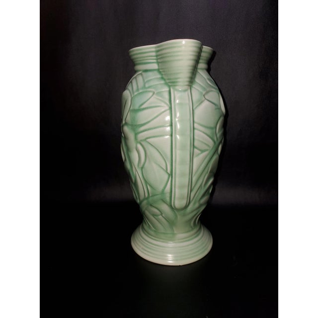 Beautiful Art Deco Pitcher marked 771, Flaxman Ware. 8.75" high. A soft mint green color. There is a small chip on bottom...