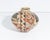 A Mata Ortiz pottery vase by the Mexican artist Cesar Dominguez. This vase features a rounded shape and an intricate,...