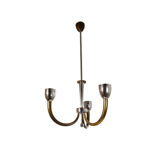 Brass and chrome-plated metal pendant with 3 lights. Good condition: 2 of 3 cups have internal defects as shown in the...