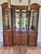 This is a fabulous neoclassical style china cabinet designed by Raymond Sabota for high-end American furniture maker...
