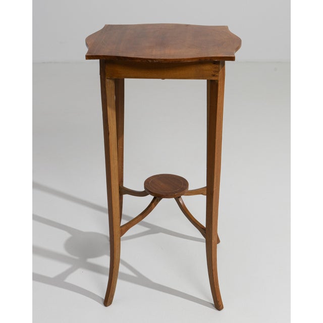 A distinguished example of Sheraton craftsmanship, this 19th-century English side table embodies the refined elegance that...