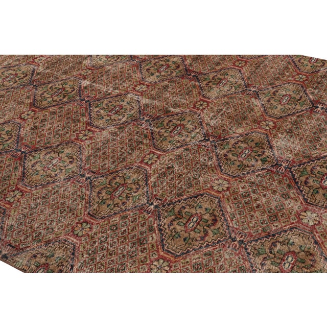 Description: This vintage rug is a 7x9 Turkish distressed piece, made with hand-knotted wool circa mid-20th century. It is...