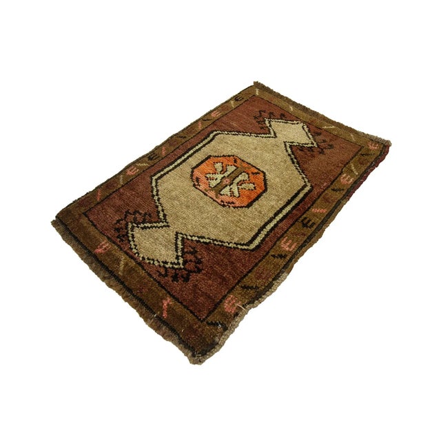 Vintage Handknotted decorative mini rug from Kars region of Turkey. Approximately 45-55 years old. In very good condition.