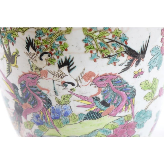 This exquisite 19th-century Chinese Famille Rose jar features intricate hand-painted designs, including delicate birds and...