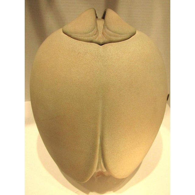 This large and rare porcelain lidded vessel/pot, signed by artist Wayne Fischer in the 1980s, is an original sculpture...