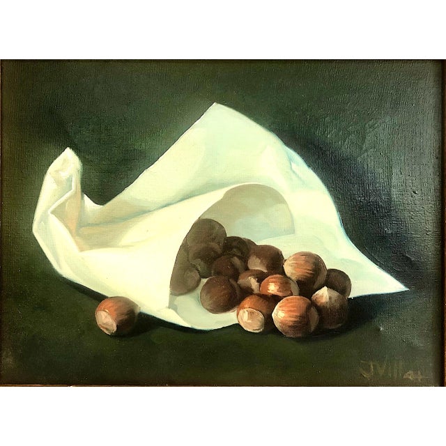On offer is a dramatic chiaroscuro-style painting of unshelled hazelnuts spilling out of a crisp white paper cone-shaped...