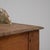 This 1900s French wooden buffet reflects a rustic charm and authenticity with its simple yet functional design. Crafted...