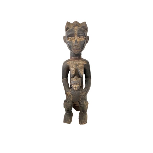 Superb Baule Maternity Figure from Cote d'Ivoire, Africa hand carved form one piece of wood , with dimensions of 18.5" H x...