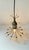 Small unusual pendant chandelier elegantly fashioned from patinated bronze embossed with floral details and set with 12...
