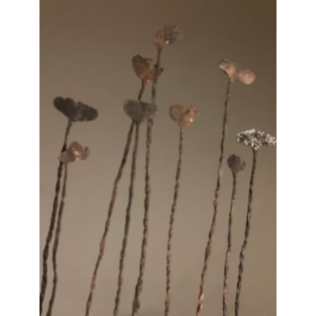 Nine individual Kissi Pennies in wood display stand. Kissy pennies were in circulation until the mid-20th Century. The...