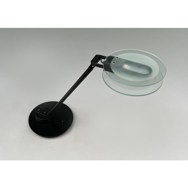 This is a super cool lamp from the 80s or 90s. It has a halogen bulb with a dimmer switch so that you can control the...