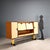 Vintage living room furniture in two-tone laminate with hinged and flap doors, open compartment and lacquered metal...