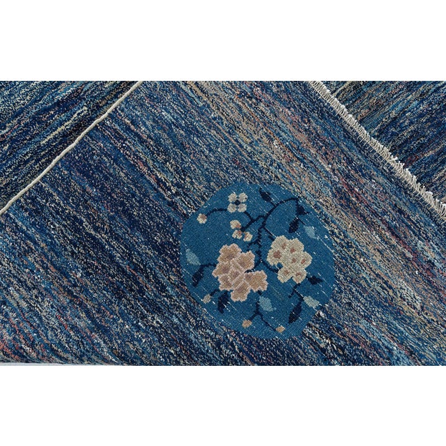 This captivating 1920s Chinese rug embodies the refined artistry and subtle modernity characteristic of early 20th-century...