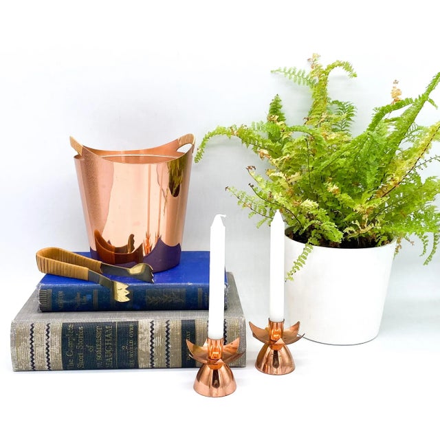 Brilliant copper petite ice bucket and tongs designed by Gunnar Ander for Ystad Metall. Rare and gorgeous set made with...
