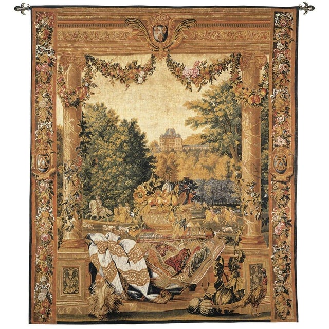 This tapestry is one from a series depicting French Royal Palaces and representing the twelve months of the year. Over the...