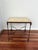 Vintage yellow tile-top side table. Dark wrought iron frame and curved stretcher base.