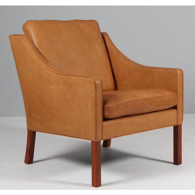 Børge Mogensen lounge chair new upholstered with cognac vintage aniline leather. Legs of teak. Model 2207, made by...