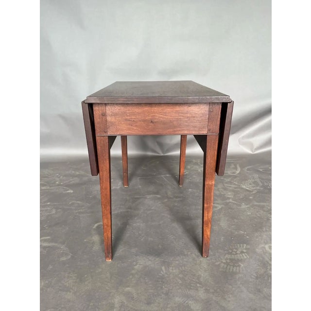 Late 18th-century Virginia Tidewater walnut drop-leaf table with yellow pine and oak secondaries, pegged construction,...