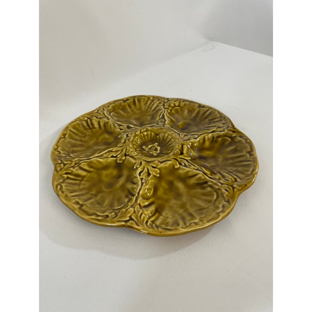 A striking glazed earthenware French Majolica (or barbotine) Oyster Plate crafted by the famous Gien workshop in France....