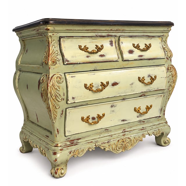 An exquisite late 20th-century French Provincial-style bombe chest of drawers by renowned American maker Thomasville....