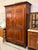 Design Plus Gallery presents a 19th Century French Provincial Carved Walnut Armoire. Constructed from solid woods, this...