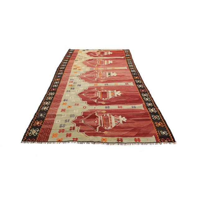 Vintage handwoven decorative kilim rug from Kars region of Turkey. Approximately 50-60 years old. In very good condition.
