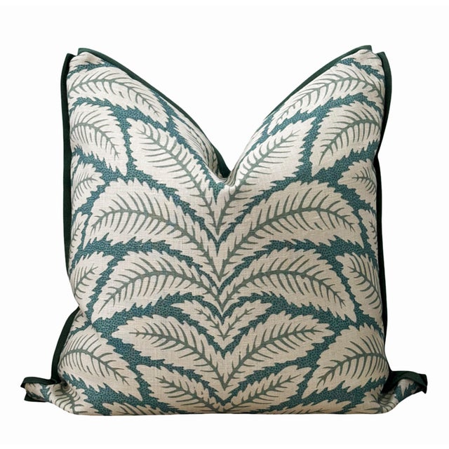 Custom pillows made with contrasting teal green linen back and butterfly flange. The linen Aqua Leaf print fabric is on...