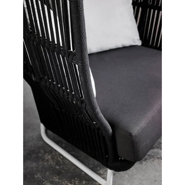 Armchair of exclusive design with high back made of 1.5mm thick aluminum frame, reinforced aluminum joints, and the fabric...