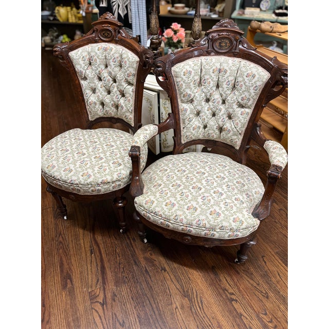 Antique American Victorian style His & Hers chairs, Rococo Revival style made of rosewood. These chairs were popular...
