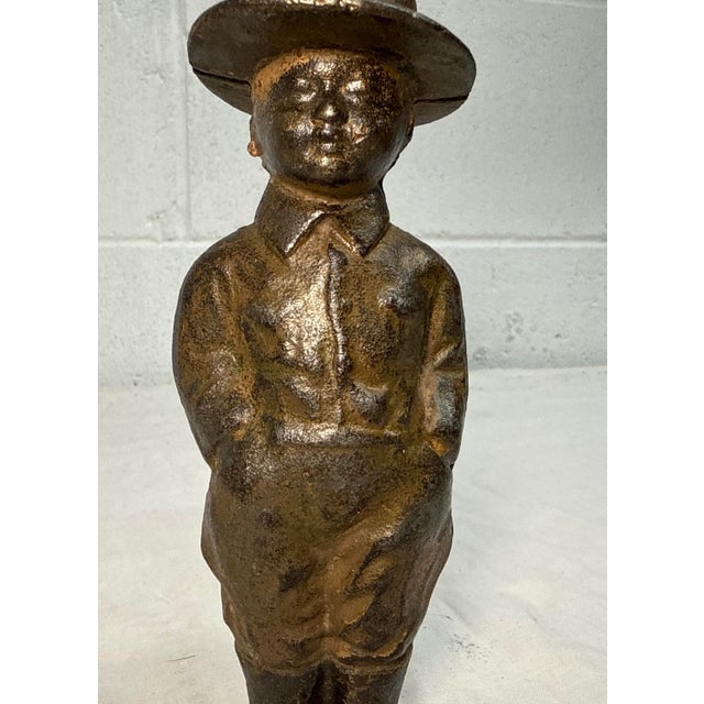 This exquisite cast iron dough boy W.W.I. soldier still bank by Grey Iron Toy Co., c. 1919 is made of thick iron and has...