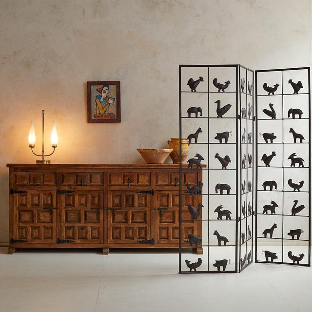 A sculptural three-panel room divider by French artist Jean Touret for Atelier de Marolles, France, circa 1950s. Hand-...